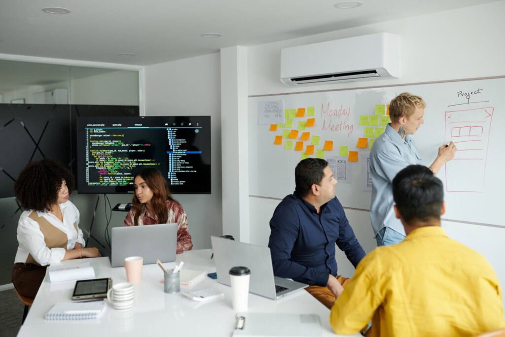 Developer Drawing on Whiteboard