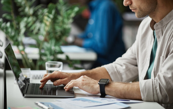 Man Working at Computer in Office Closeup
