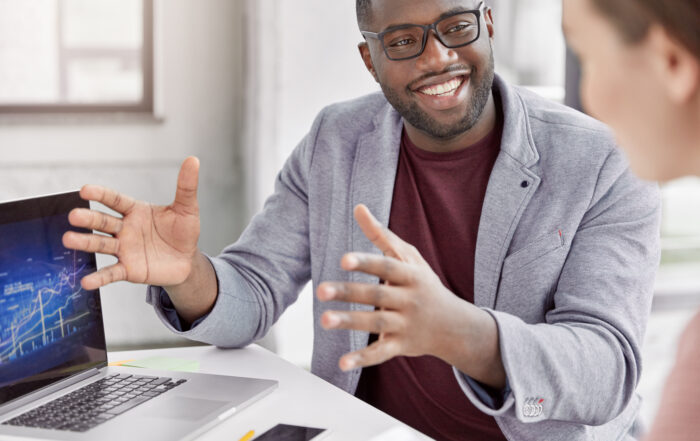 INtune Consultant expert with cheerful expression makes speech during meeting with business partner