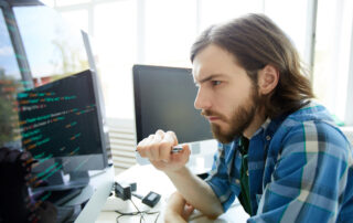 developer looking at data code on computer screen