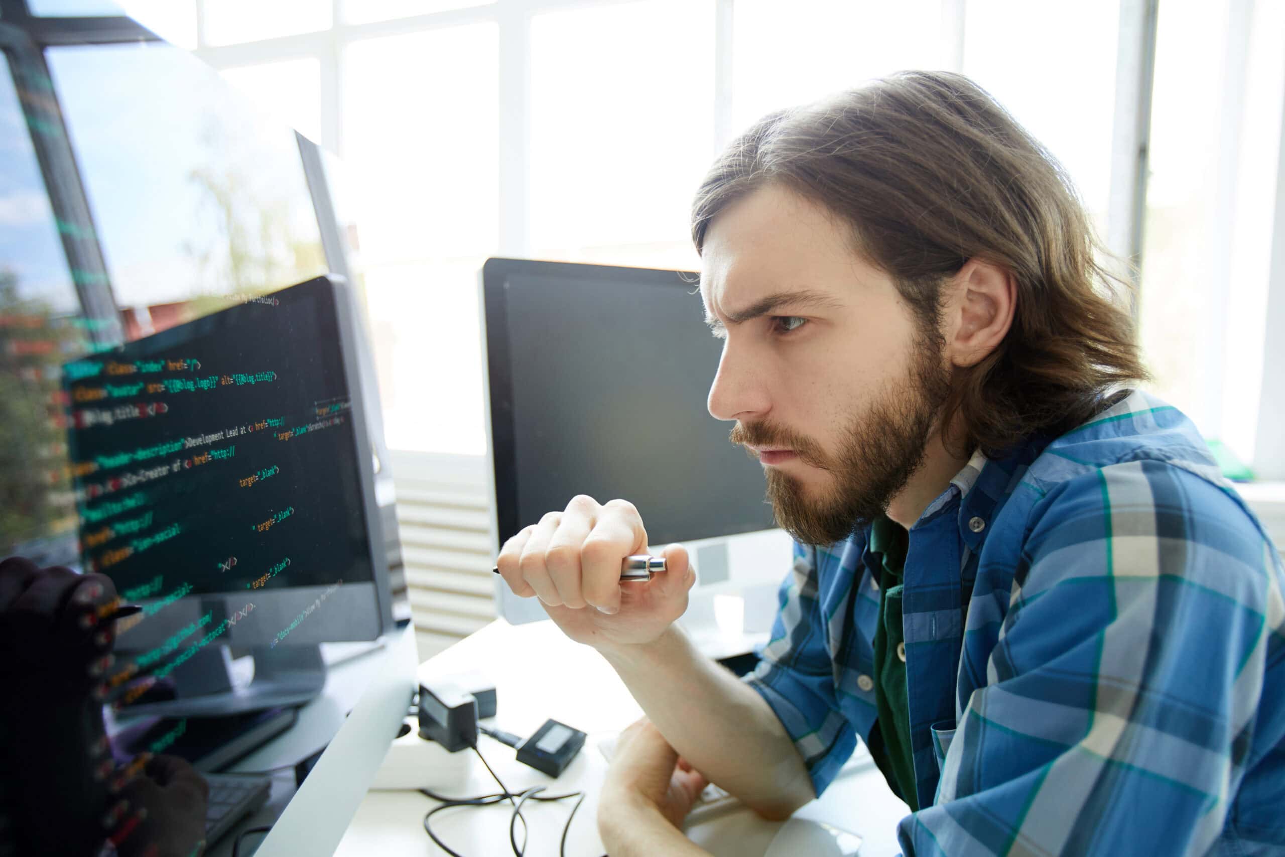 developer looking at data code on computer screen